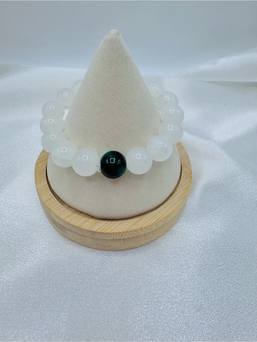 White Beaded Bracelet with Single Dark Accent Bead
